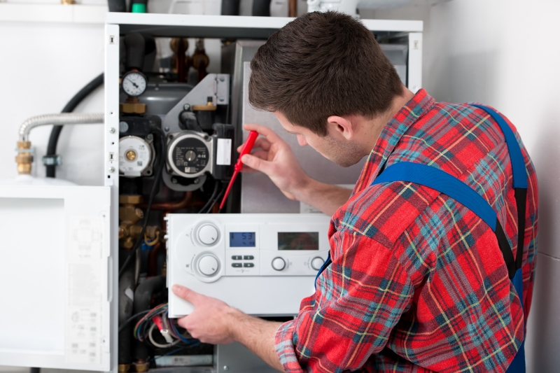 Gas Safe engineer working on a boiler in Thornton Heath
